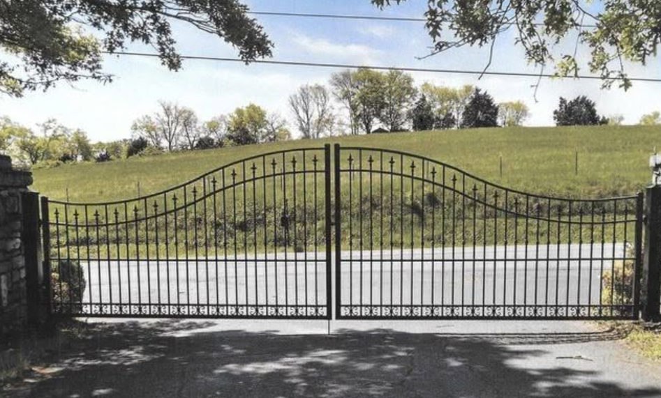 Decorative iron estate gate overlooking rolling Tennessee hills