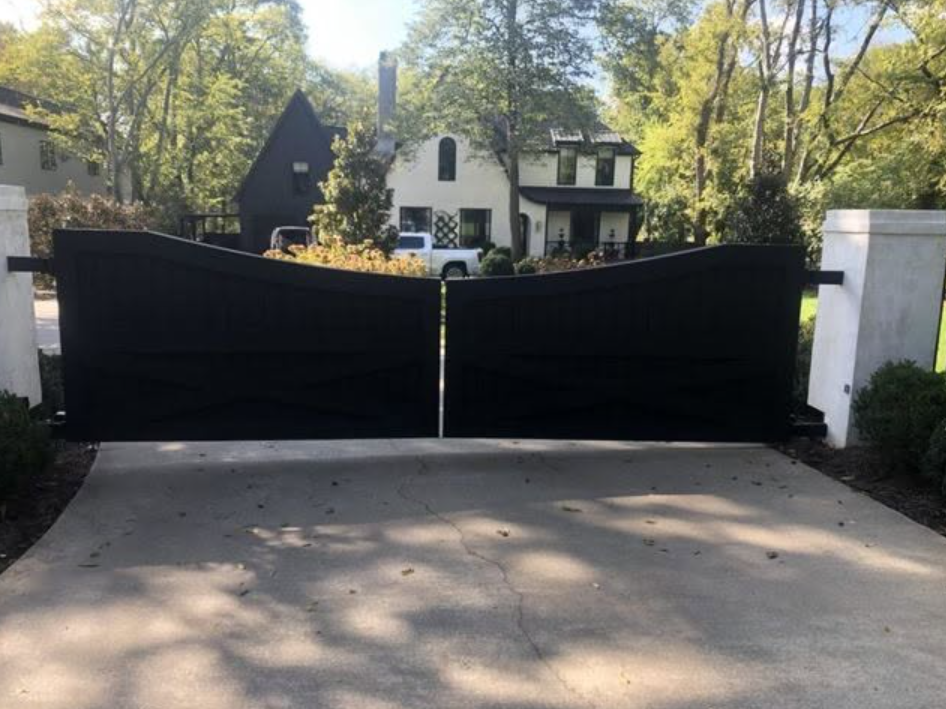 Black custom estate gate with contemporary curved top